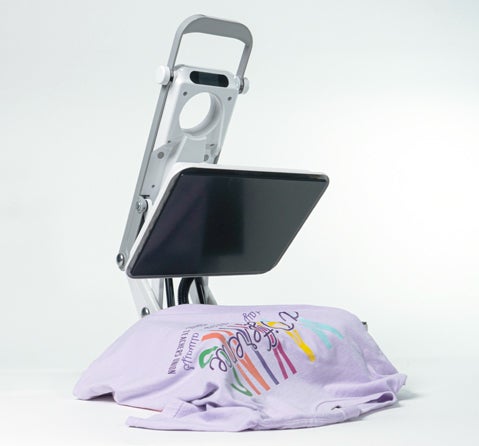 MerchMaker heat press printing a shirt